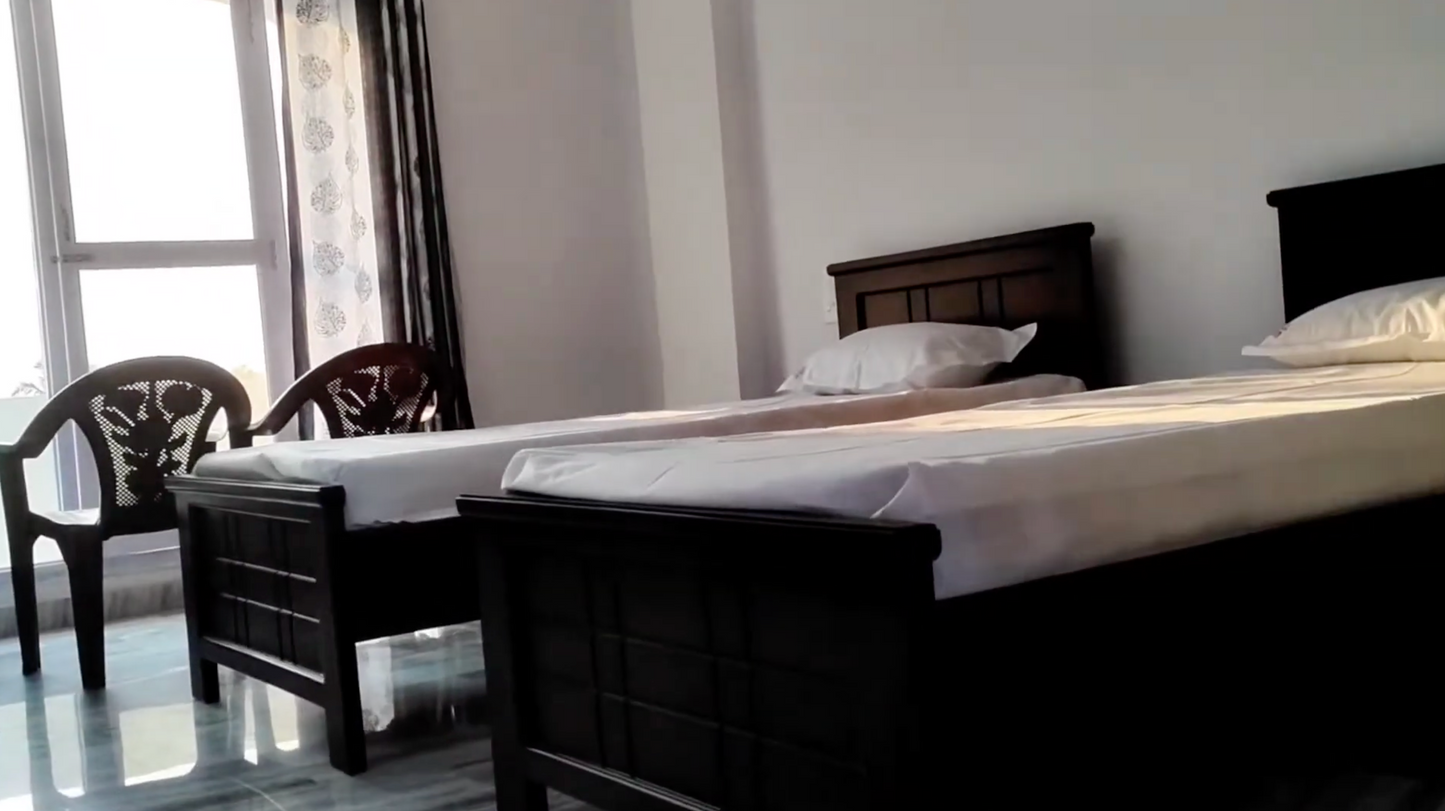 Twin Sharing (Per Devotee) - Shared room for two devotees- Air Conditioned