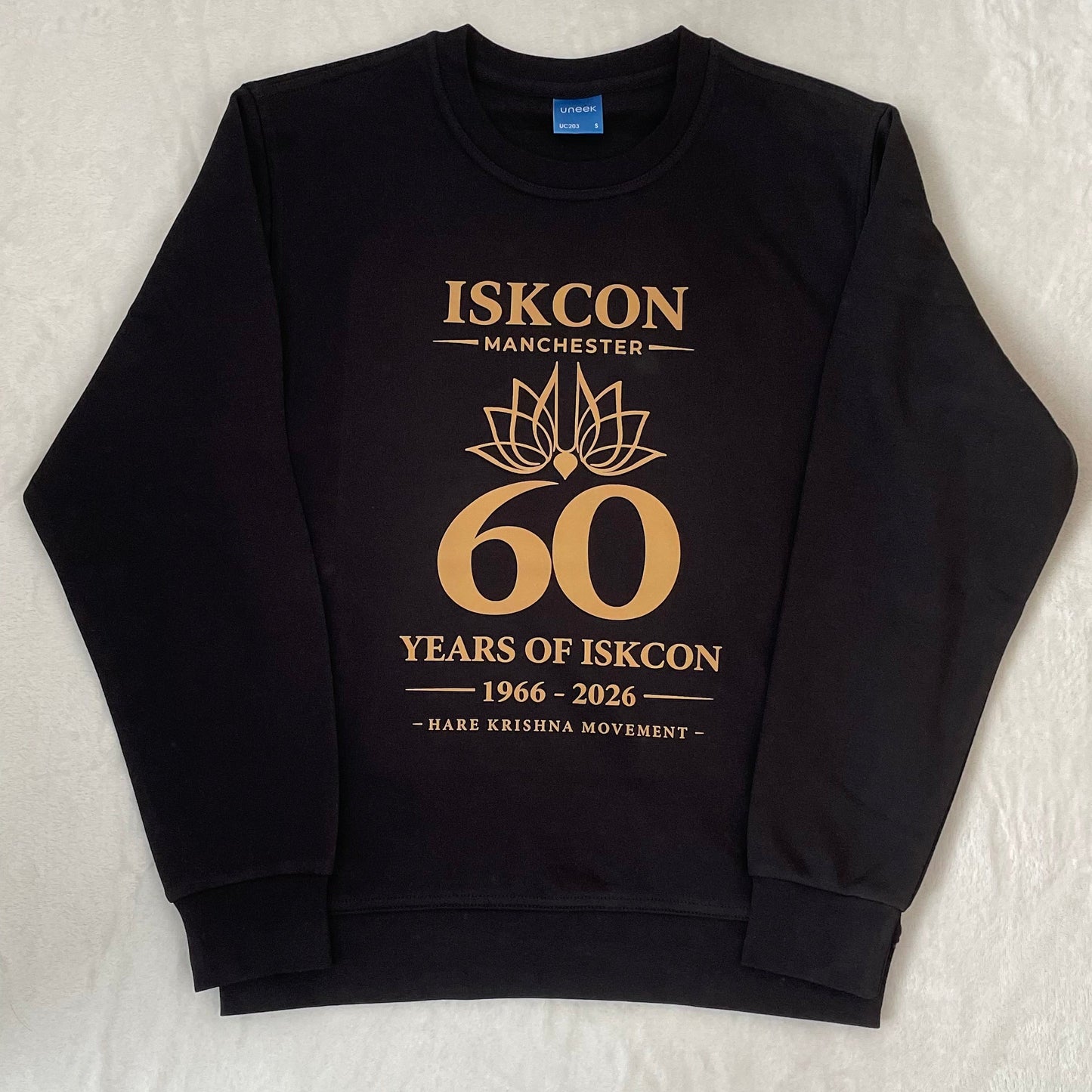 Black sweatshirt with gold text and design on a white background