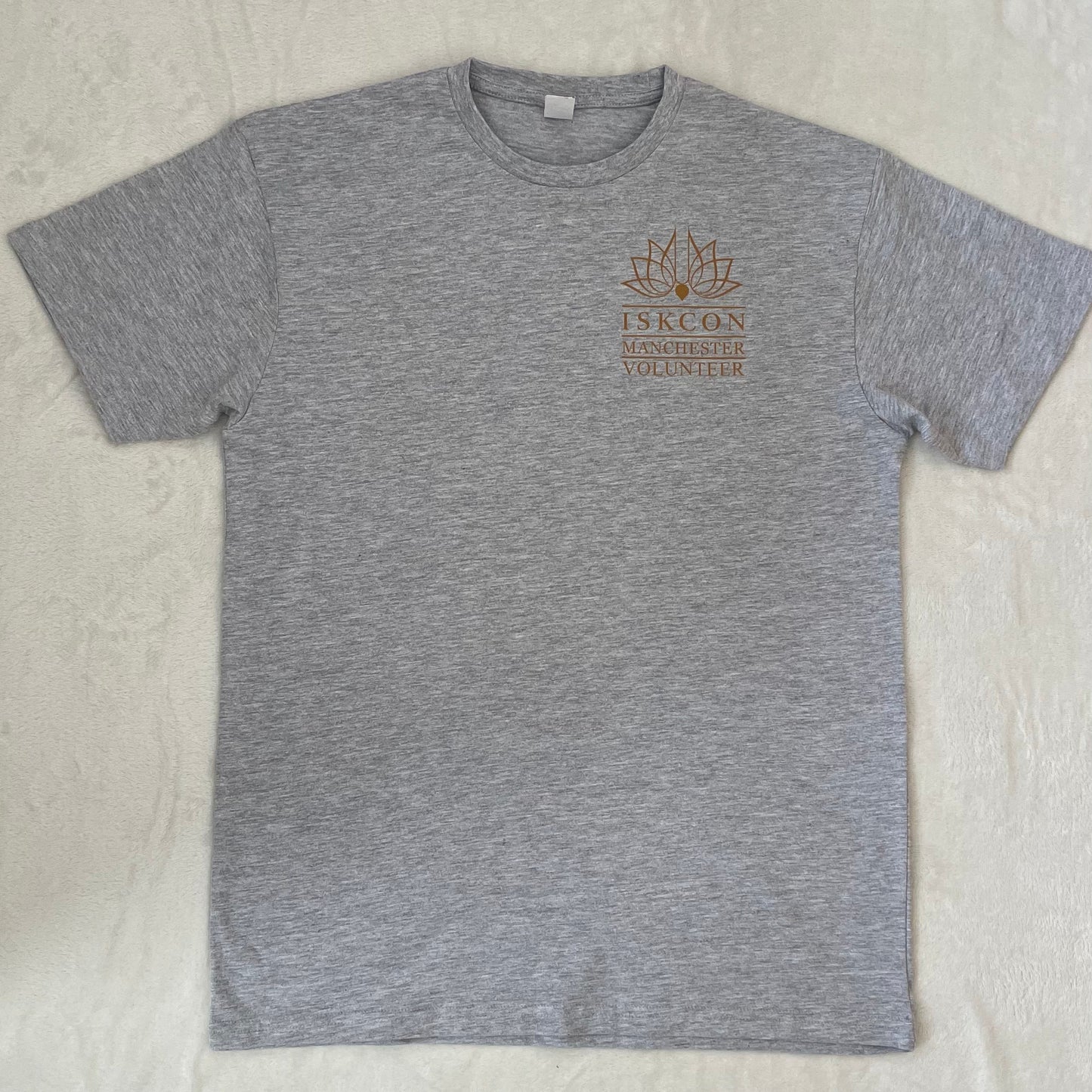 Gray t-shirt with a logo and text on a light gray background